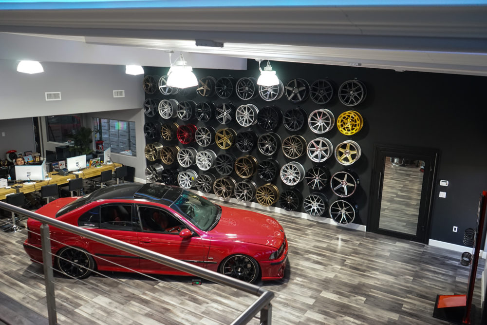 n4sm need 4 speed motorsports showroom top level view of wheel wall from front